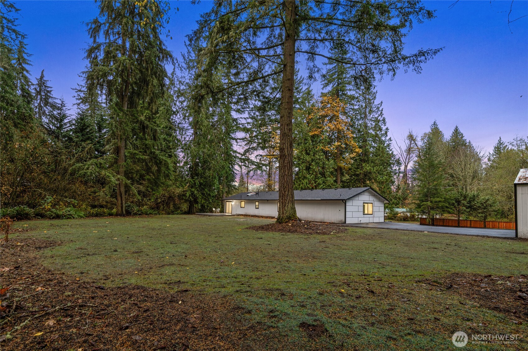 12528 Odell Road Northeast Duvall, WA 98019 - Photo 39 of 39 a view of a house with a yard