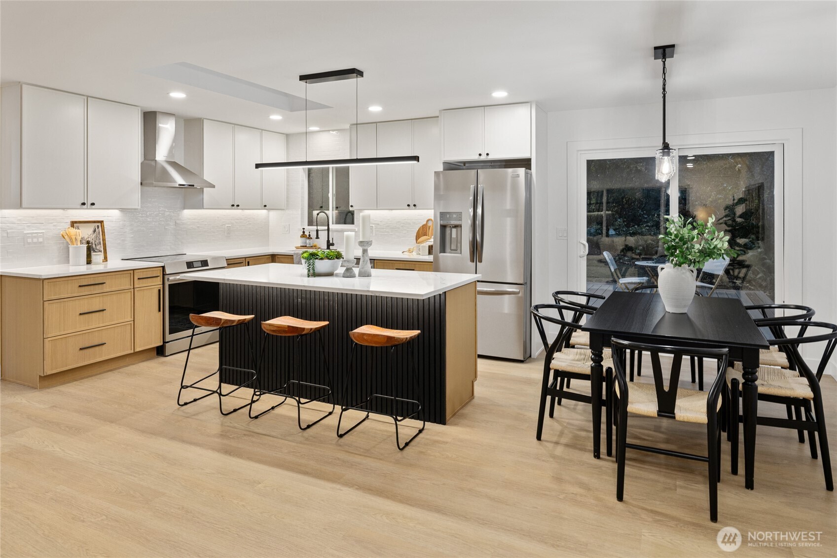 12528 Odell Road Northeast Duvall, WA 98019 - Photo 10 of 39 a kitchen with kitchen island a dining table and chairs