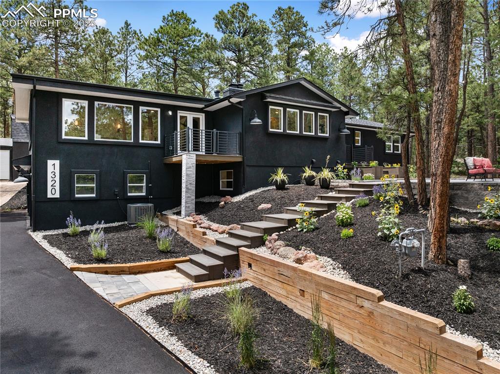 a front view of a house with garden