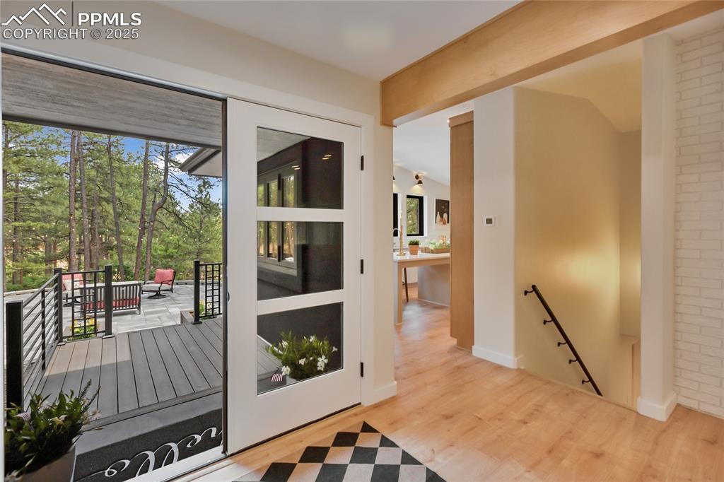 1320 Spring Valley Drive Colorado Springs, CO 80921 - Photo 11 of 46 a living room with furniture and a floor to ceiling window