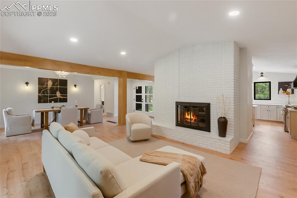 1320 Spring Valley Drive Colorado Springs, CO 80921 - Photo 12 of 46 a living room with furniture and a fireplace