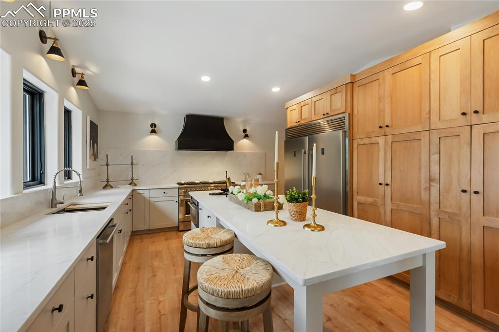 1320 Spring Valley Drive Colorado Springs, CO 80921 - Photo 14 of 46 a kitchen with a table chairs stove and kitchen view