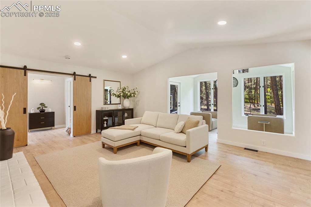 1320 Spring Valley Drive Colorado Springs, CO 80921 - Photo 16 of 46 a living room with furniture and a large window