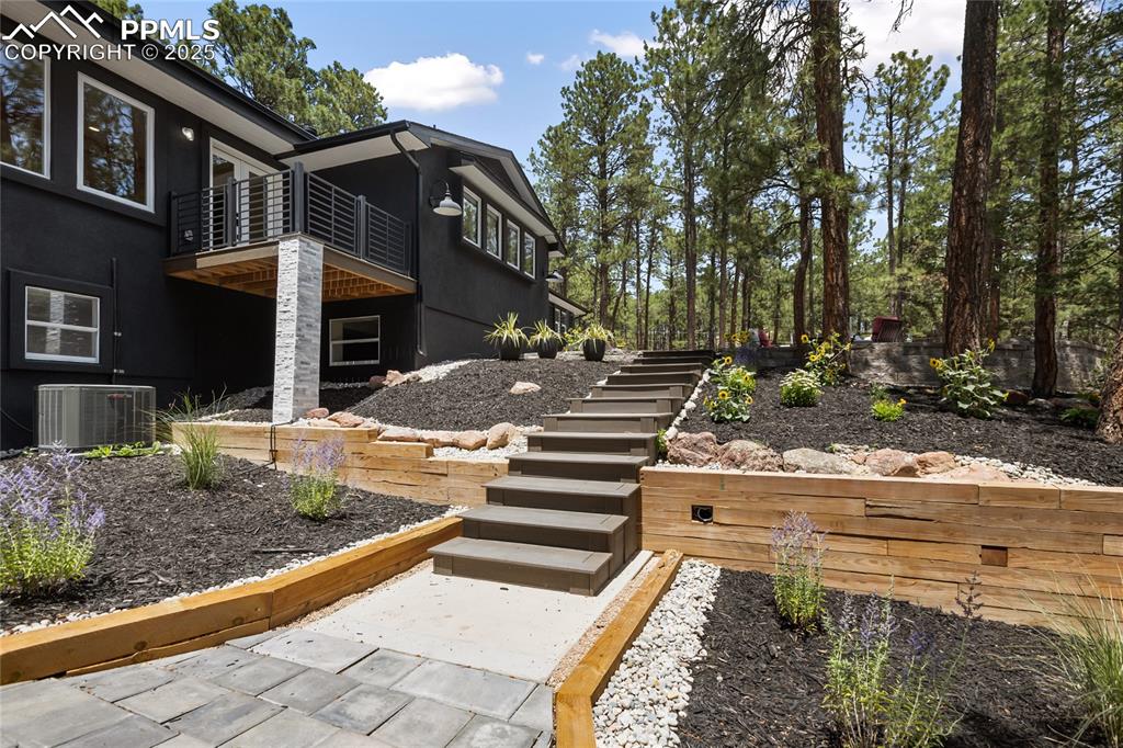1320 Spring Valley Drive Colorado Springs, CO 80921 - Photo 2 of 46 a front view of a house with a yard
