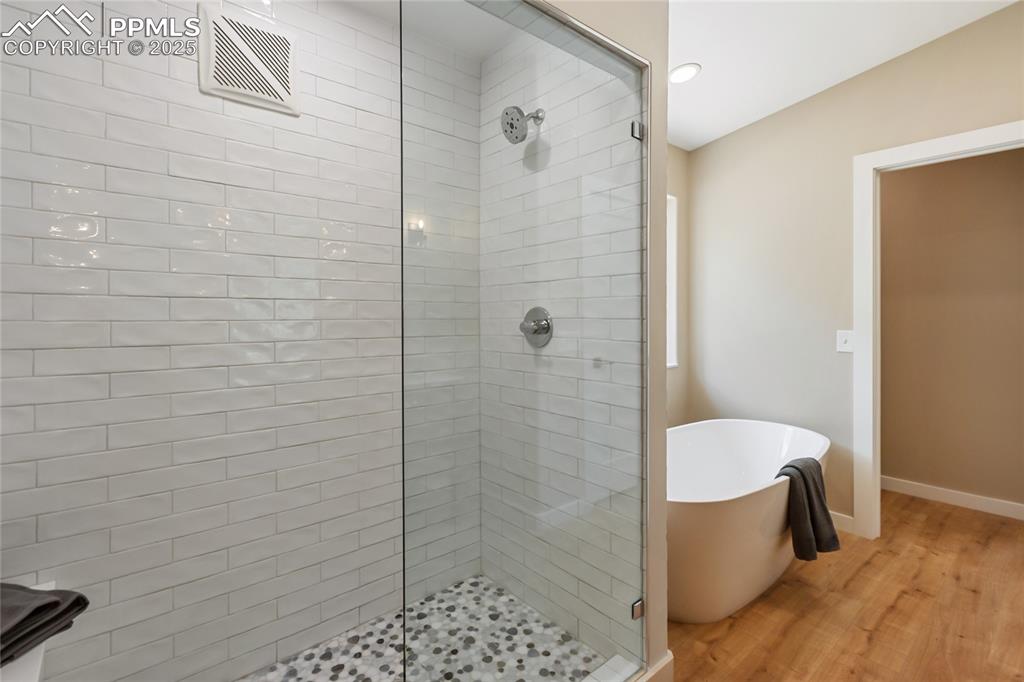 1320 Spring Valley Drive Colorado Springs, CO 80921 - Photo 22 of 46 a bathroom with a bathtub and shower