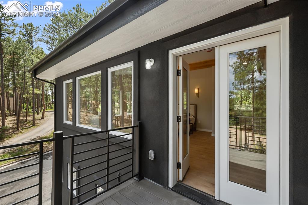 1320 Spring Valley Drive Colorado Springs, CO 80921 - Photo 25 of 46 a view of a balcony with wooden floor and outdoor space