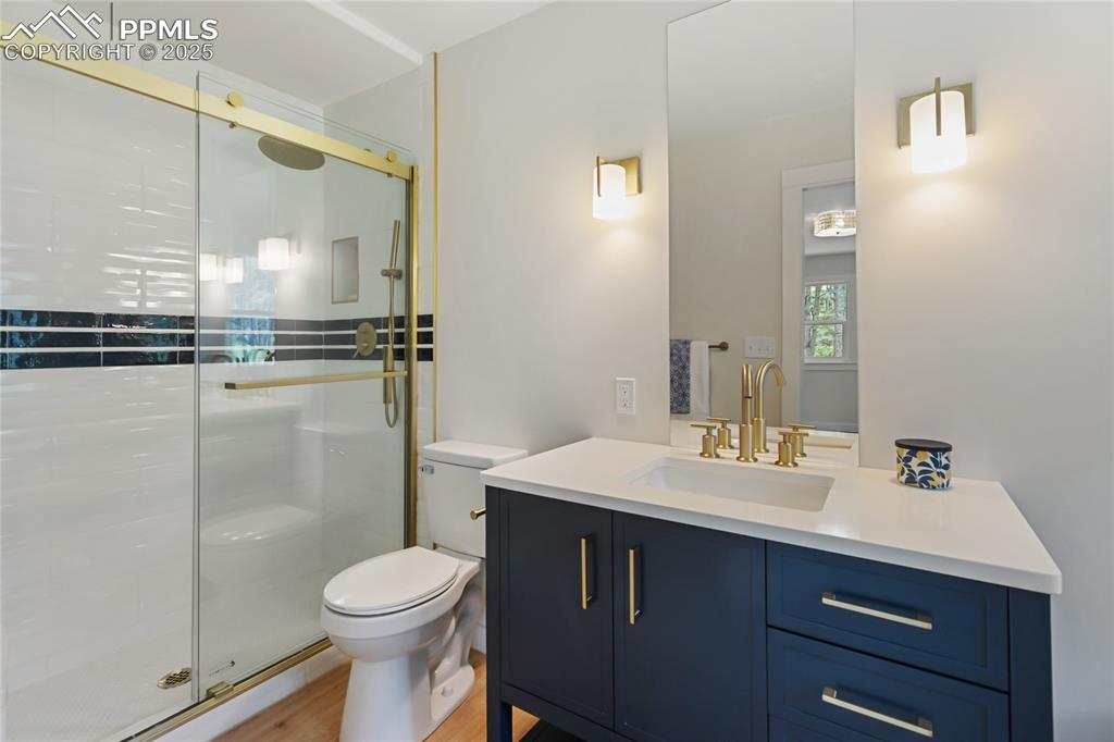 1320 Spring Valley Drive Colorado Springs, CO 80921 - Photo 30 of 46 a bathroom with a sink toilet and shower