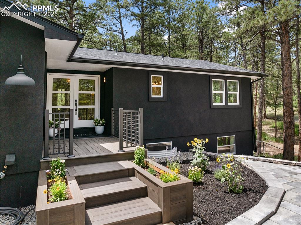 1320 Spring Valley Drive Colorado Springs, CO 80921 - Photo 3 of 46 a front view of house with yard outdoor seating and barbeque oven