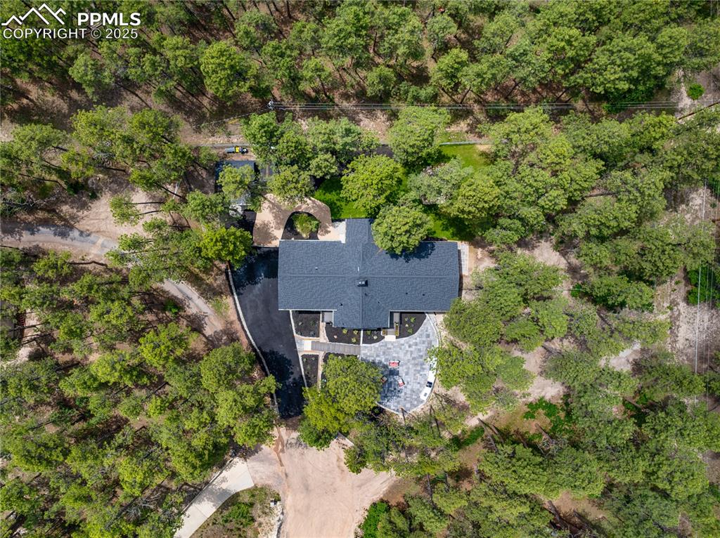 1320 Spring Valley Drive Colorado Springs, CO 80921 - Photo 40 of 46 an aerial view of a house with yard and outdoor seating