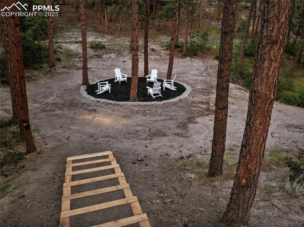 1320 Spring Valley Drive Colorado Springs, CO 80921 - Photo 44 of 46 a front view of a house with a yard