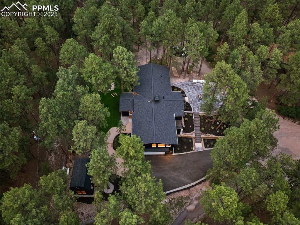 1320 Spring Valley Drive Colorado Springs, CO 80921 - Photo 45 of 46 an aerial view of a house with a yard and tree s