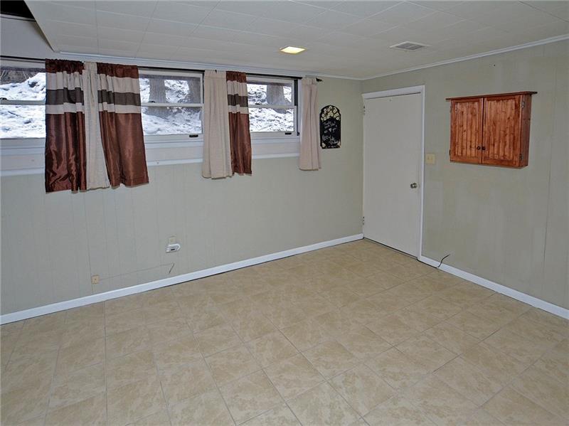 109 Leslie Road Monroeville, PA 15146 - Photo 19 of 24 Game room area. Direct access to garage and half bath and Laundry Room. washer and Dryer included.