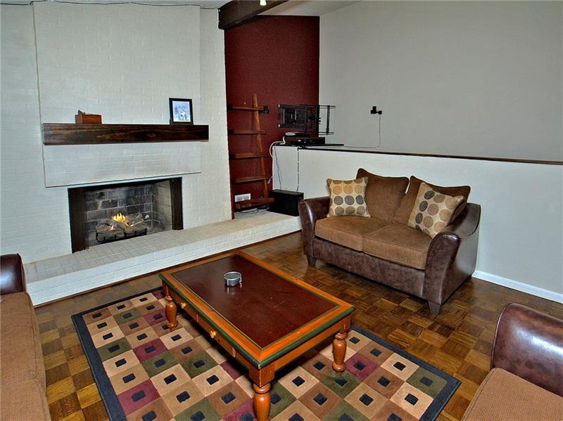 109 Leslie Road Monroeville, PA 15146 - Photo 10 of 24 Living Room with gas fireplace. TV set up on shelf included. Nice open floor plan.
