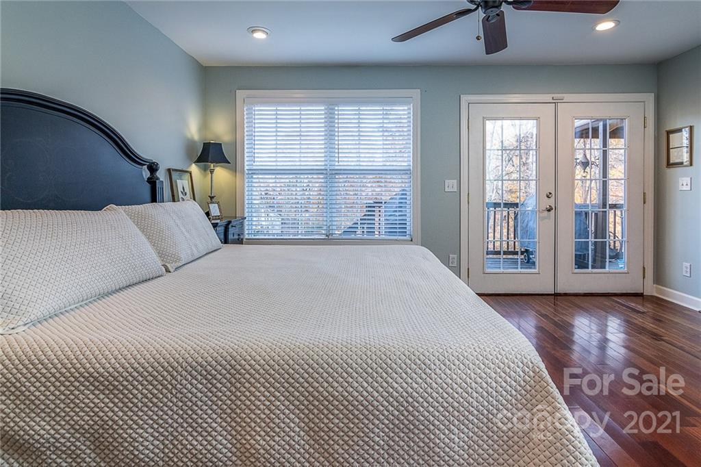 254 Beaten Path Road Mooresville, NC 28117 - Photo 12 of 35 a bedroom with a large bed and a large window