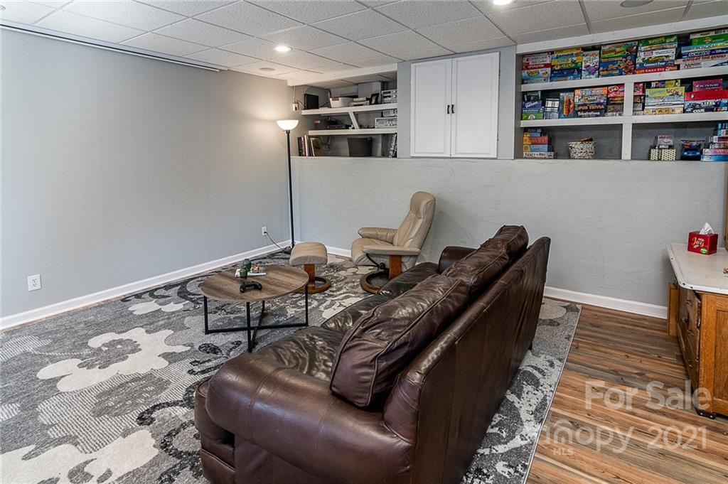254 Beaten Path Road Mooresville, NC 28117 - Photo 21 of 35 a living room with hard wood flooring and a couch