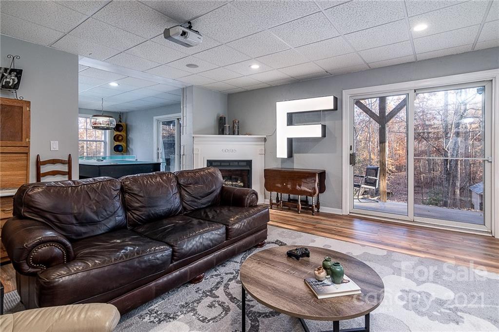 254 Beaten Path Road Mooresville, NC 28117 - Photo 22 of 35 a living room with furniture and a fireplace