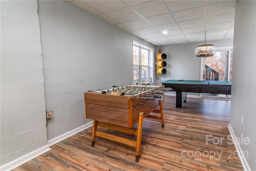 254 Beaten Path Road Mooresville, NC 28117 - Photo 25 of 35 a living room with furniture a piano and wooden floor