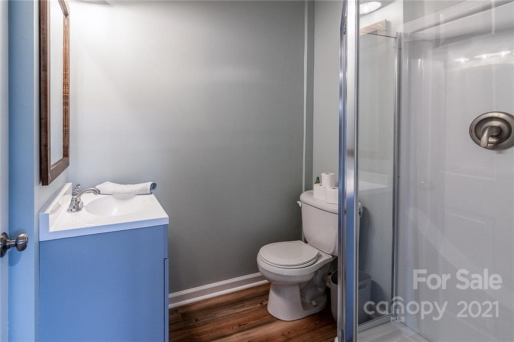 254 Beaten Path Road Mooresville, NC 28117 - Photo 28 of 35 a white toilet sitting next to a bathroom sink