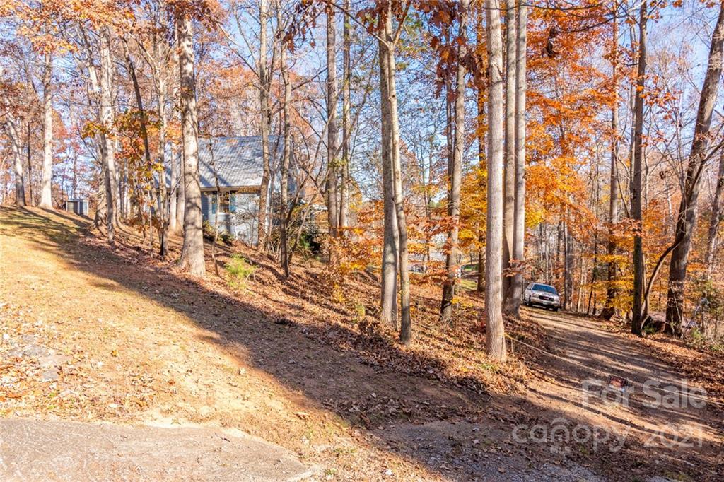 254 Beaten Path Road Mooresville, NC 28117 - Photo 32 of 35 a view of a pathway of a yard with wooden fence