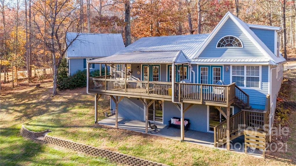 254 Beaten Path Road Mooresville, NC 28117 - Photo 35 of 35 a view of a house with a yard chairs and wooden fence