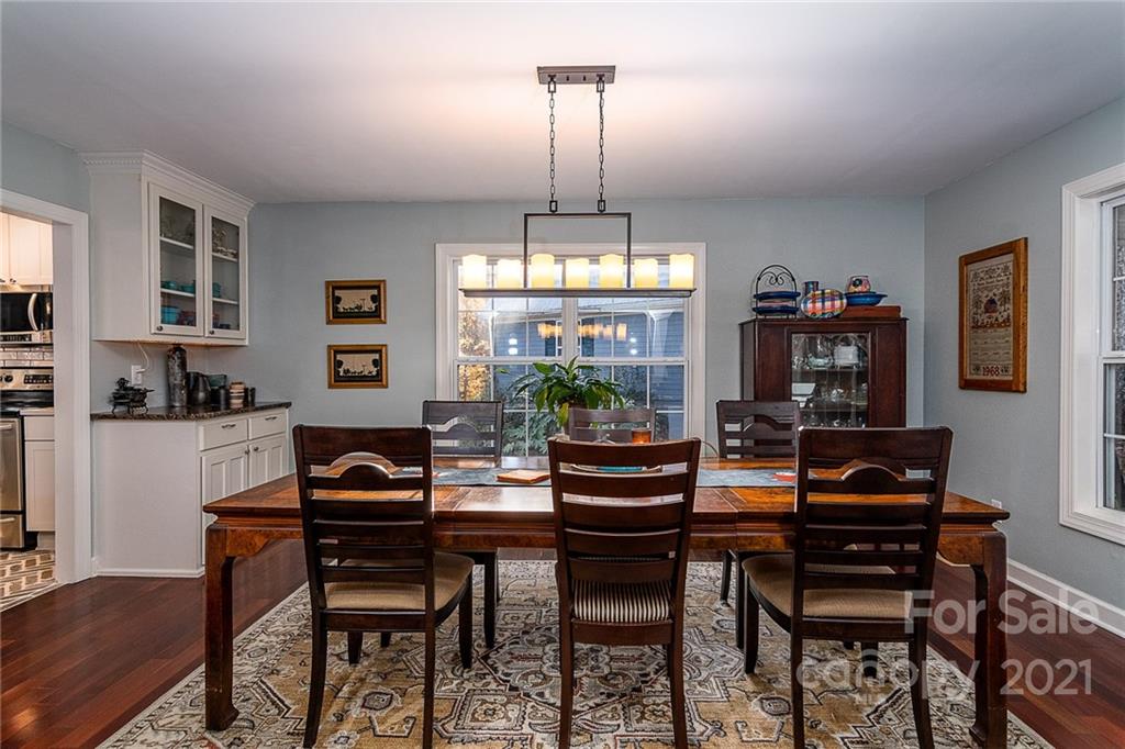 254 Beaten Path Road Mooresville, NC 28117 - Photo 6 of 35 a view of a dining room with furniture window and wooden floor