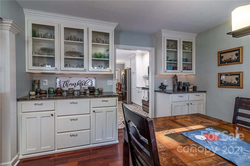 254 Beaten Path Road Mooresville, NC 28117 - Photo 7 of 35 a kitchen with granite countertop cabinets and window