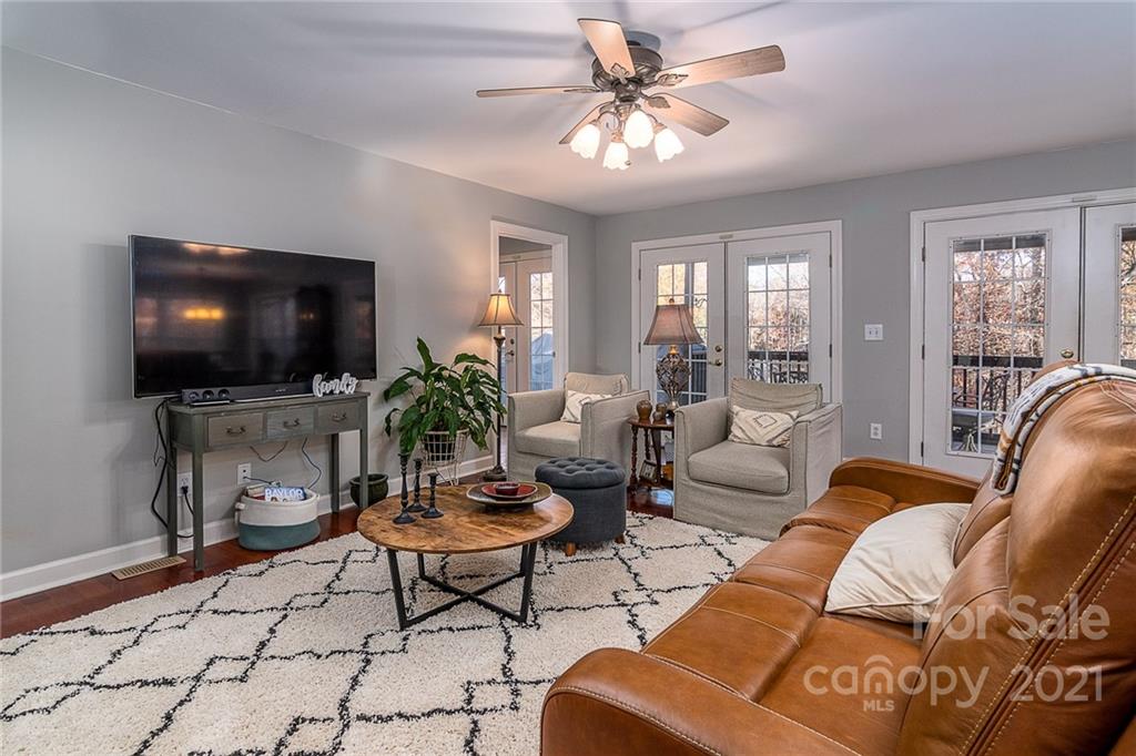 254 Beaten Path Road Mooresville, NC 28117 - Photo 8 of 35 a living room with furniture and a flat screen tv