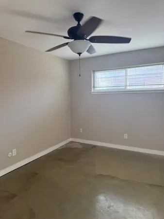 a view of a hallway with a room