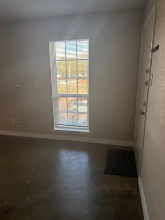 a view of a hallway with seating area