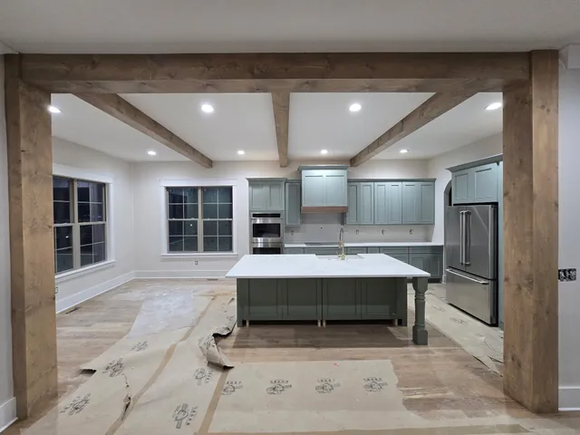 a view of a big room with furniture and window