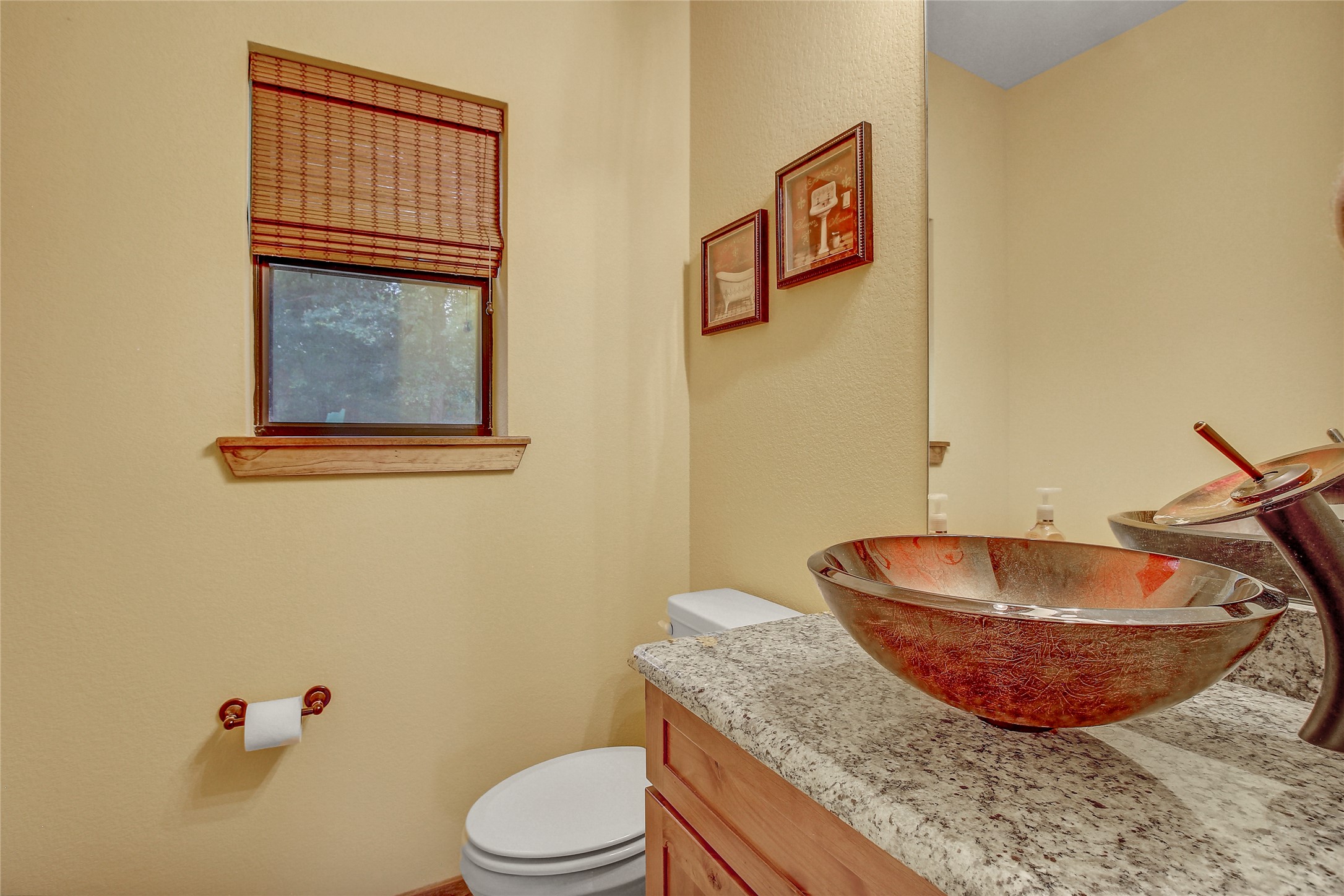 18197 Fm 619 Elgin, TX 78621 - Photo 26 of 39 a bathroom with a granite countertop toilet and a sink