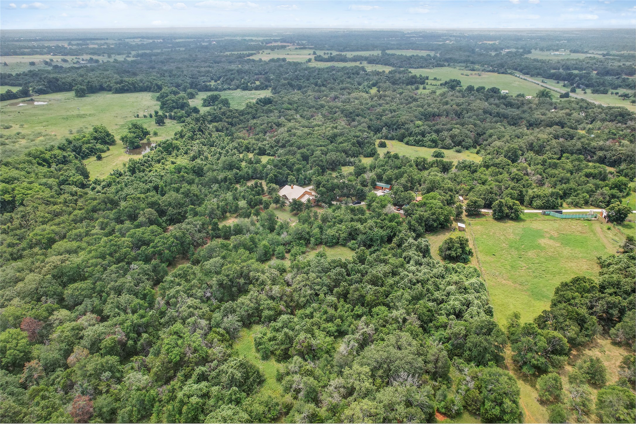 18197 Fm 619 Elgin, TX 78621 - Photo 37 of 39 an aerial view of residential houses with outdoor space and trees