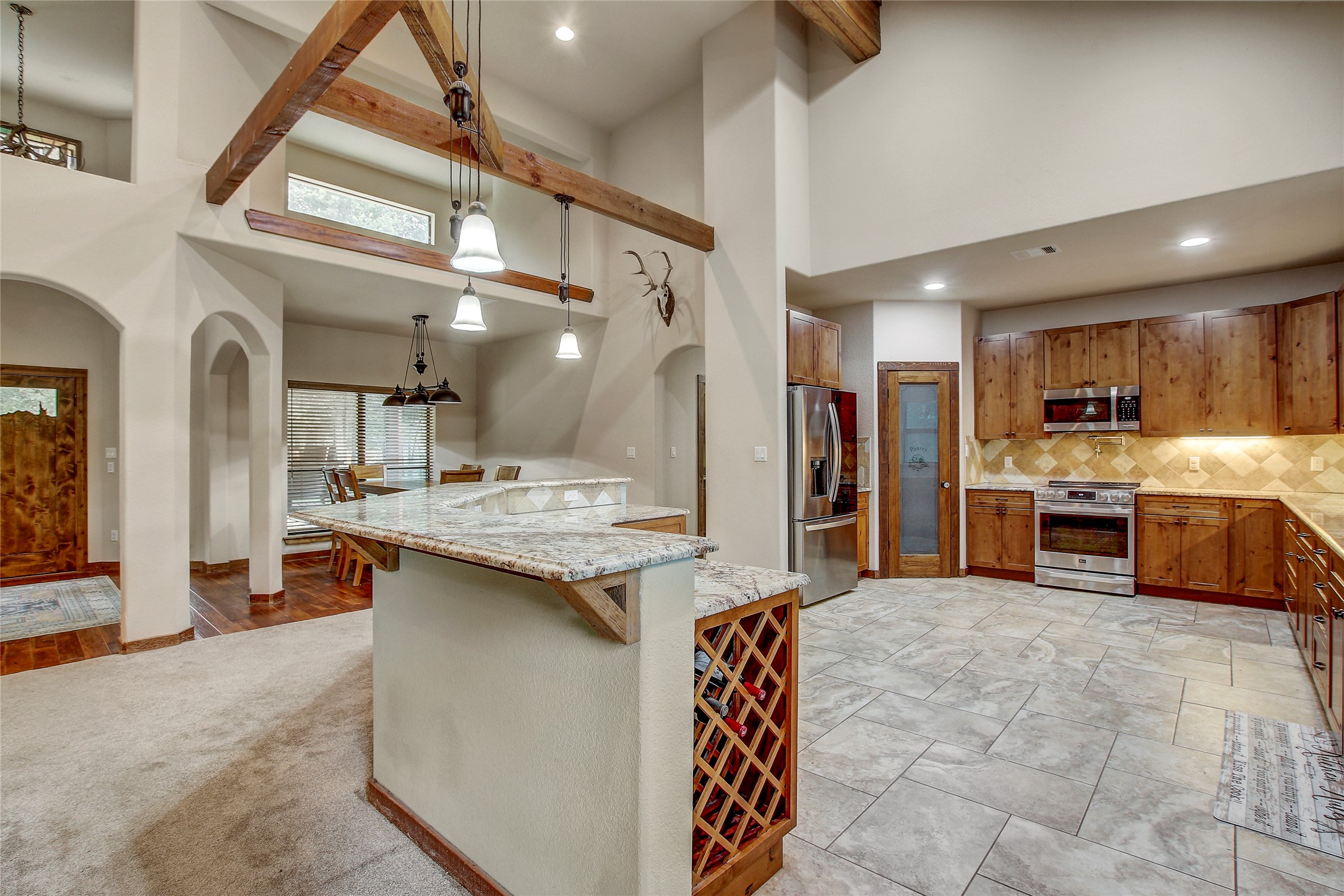 18197 Fm 619 Elgin, TX 78621 - Photo 9 of 39 a kitchen with stainless steel appliances kitchen island granite countertop a sink and cabinets