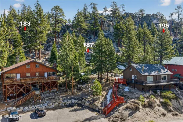 an aerial view of a house with swimming pool garden and outdoor seating