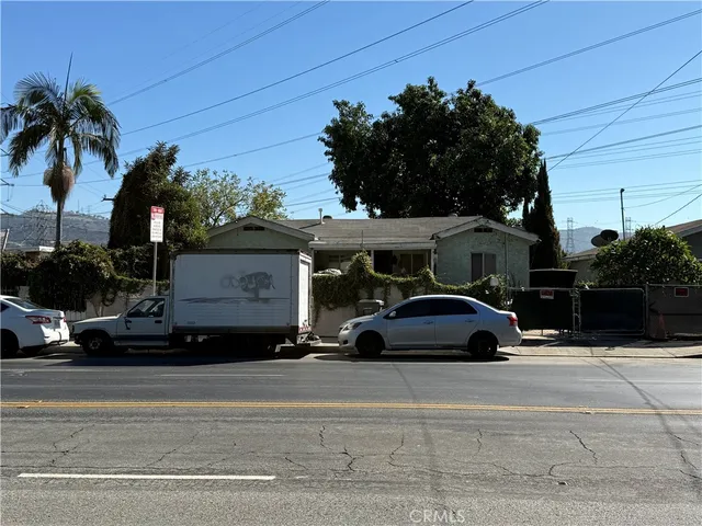 a view of street with parked cars