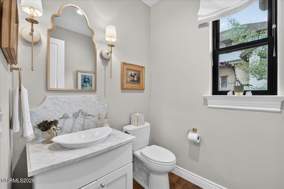 5096 Bordeaux Court Reno, NV 89511 - Photo 32 of 70 a bathroom with a granite countertop sink mirror and toilet
