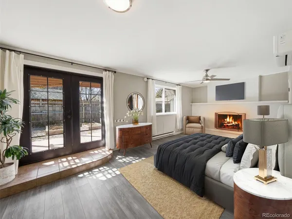 a bedroom with a bed and glass window