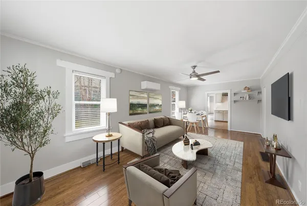 a living room with furniture and a flat screen tv