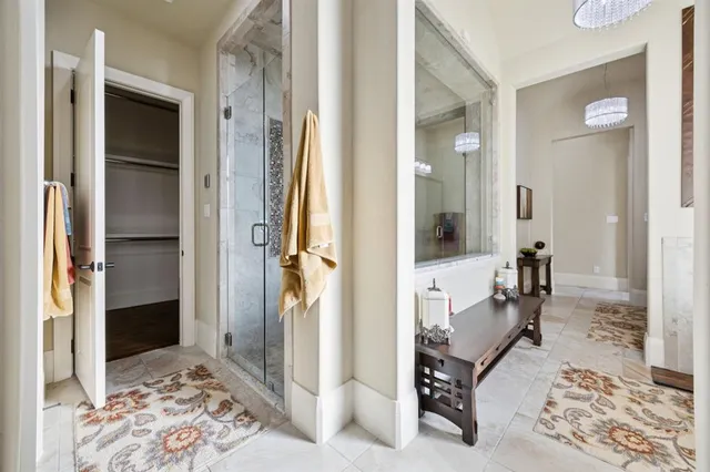 a view of a hallway with living room and dining room