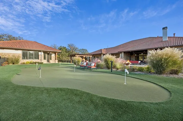 an outdoor view of house with swimming pool