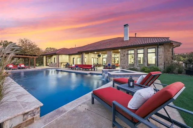 a view of a roof deck with couches chairs with wooden floor