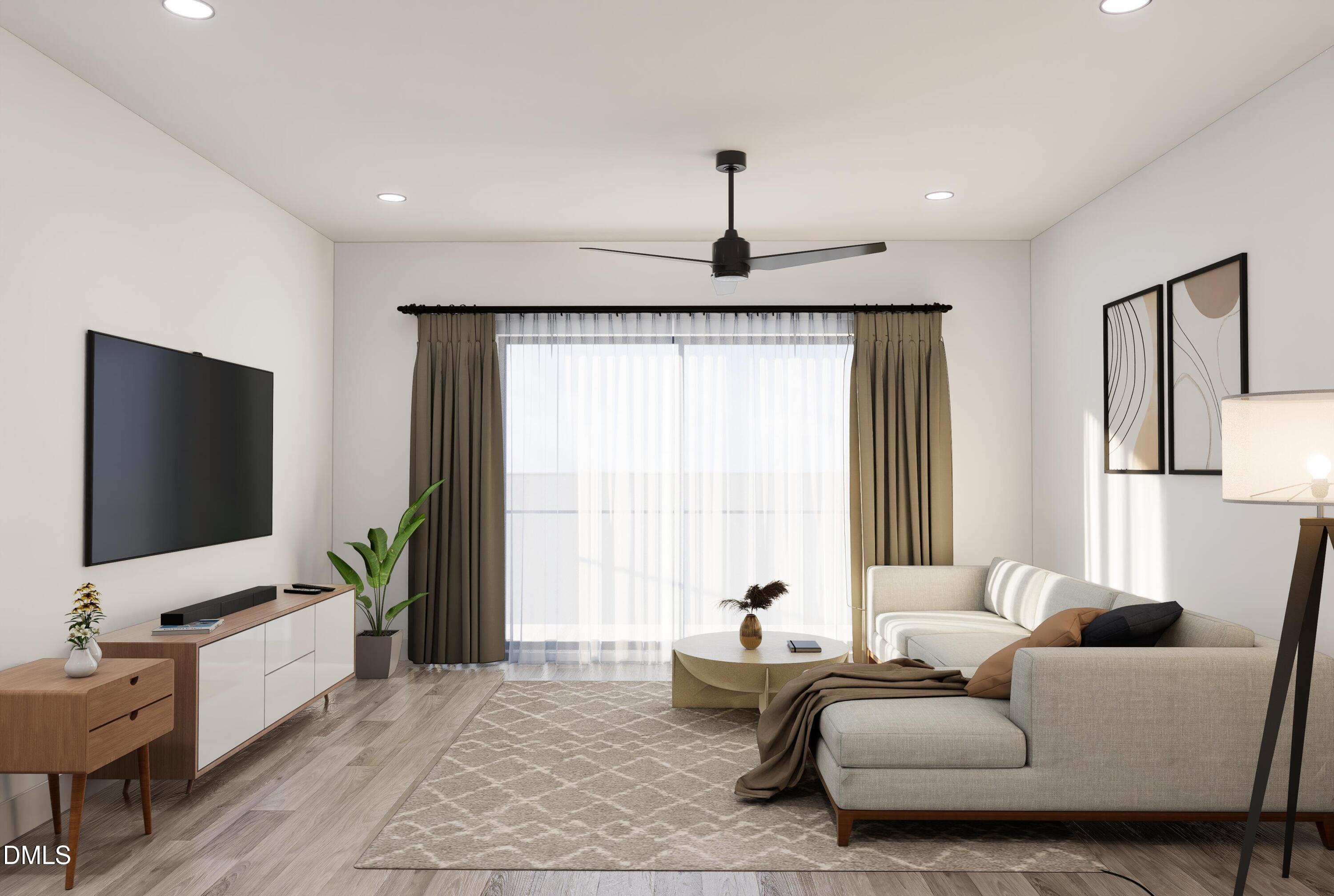 709 East Lenoir Street, Unit 304 Raleigh, NC 27601 - Photo 3 of 11 a living room with furniture and a flat screen tv
