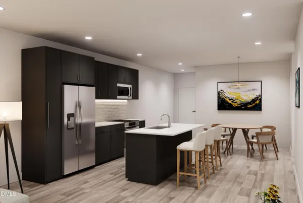 a kitchen with stainless steel appliances granite countertop a refrigerator a sink a stove a dining table and chairs