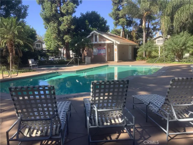 a view of a chairs and table in the patio