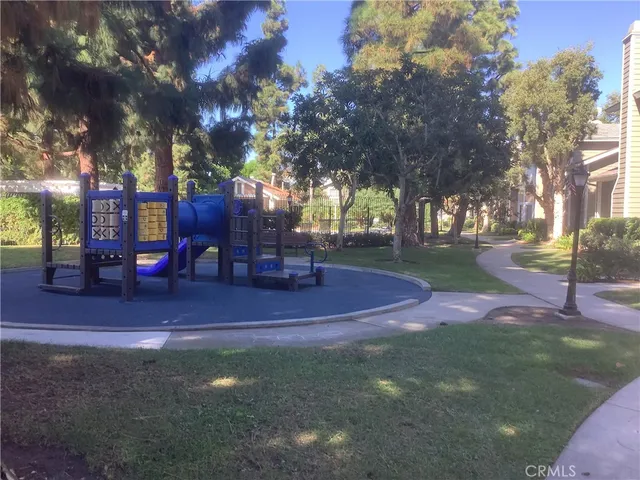 a view of yard with patio and trees