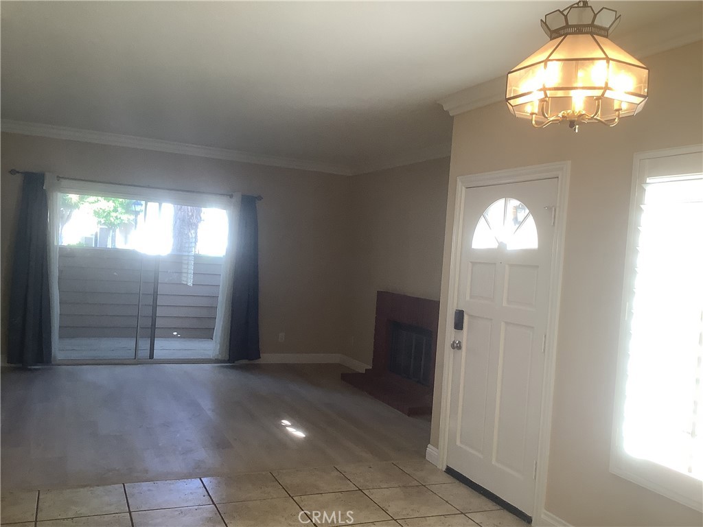186 Monroe Irvine, CA 92620 - Photo 5 of 12 en view of a hallway with windows and chandelier