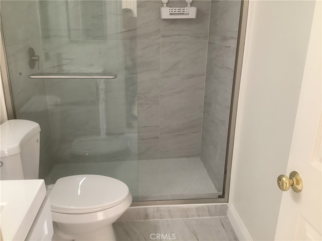 186 Monroe Irvine, CA 92620 - Photo 7 of 12 a bathroom with a toilet and a shower
