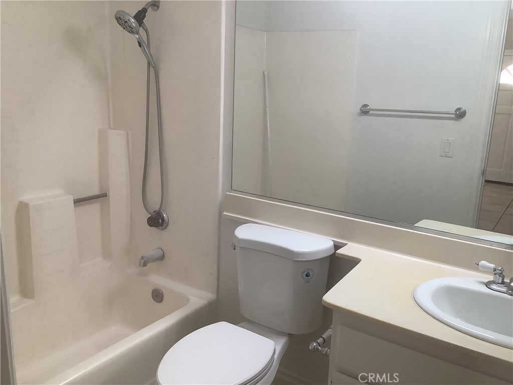 186 Monroe Irvine, CA 92620 - Photo 8 of 12 a bathroom with a sink toilet and shower