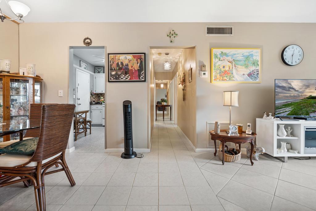 400 South Cypress Road, Unit 424 Pompano Beach, FL 33060 - Photo 19 of 40 a view of a livingroom with furniture and a flat screen tv