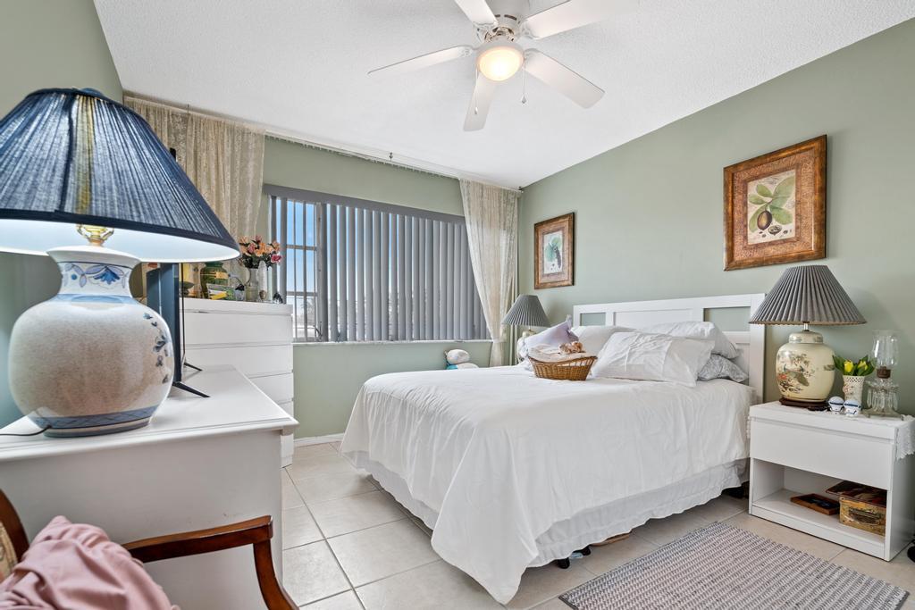 400 South Cypress Road, Unit 424 Pompano Beach, FL 33060 - Photo 21 of 40 a bedroom with a bed and window